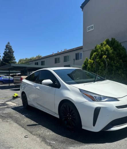 Exterior hand wash on a white Prius